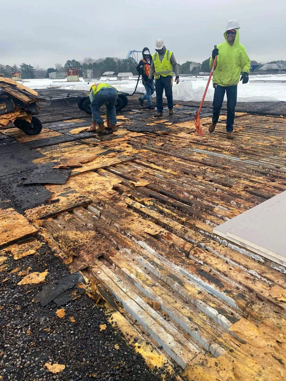 Crew replacing a commercial roof